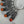 Load and play video in Gallery viewer, ORANGE SPINY STATEMENT FEATHER EAR HUGGER (LEFT EAR)