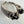 Load image into Gallery viewer, BLACK ONYX AND WHITE TOPAZ WRAPAROUND RING ADJUSTABLE (MW 238)
